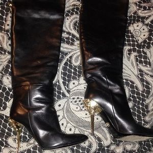 Versace boots with face on heels